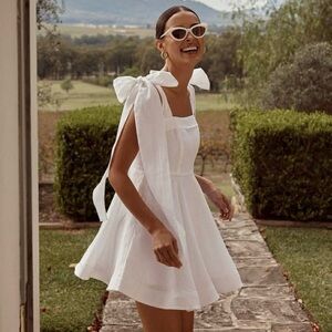 NEW DISSH Aisle White Linen Bow Mini Dress (Sz US 2) Shoulder Ties Circle Skirt